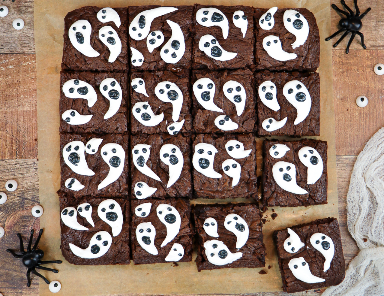 Brownies baked and cut and decorated with ghost designs